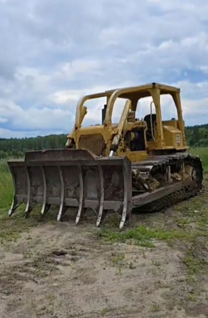 Land clearing bulldozer with rake blade for excavation contractor Fergus Falls, MN Land clearing bulldozer with rake blade for excavation contractor Fergus Falls, MN