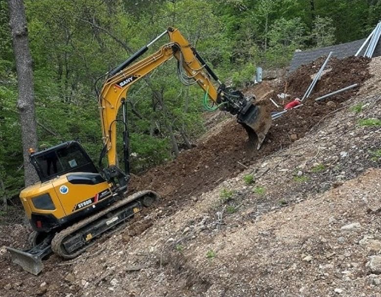Sany SY80U compact excavator grading a slope near Fergus Falls, MN Sany SY80U compact excavator grading a slope near Fergus Falls, MN
