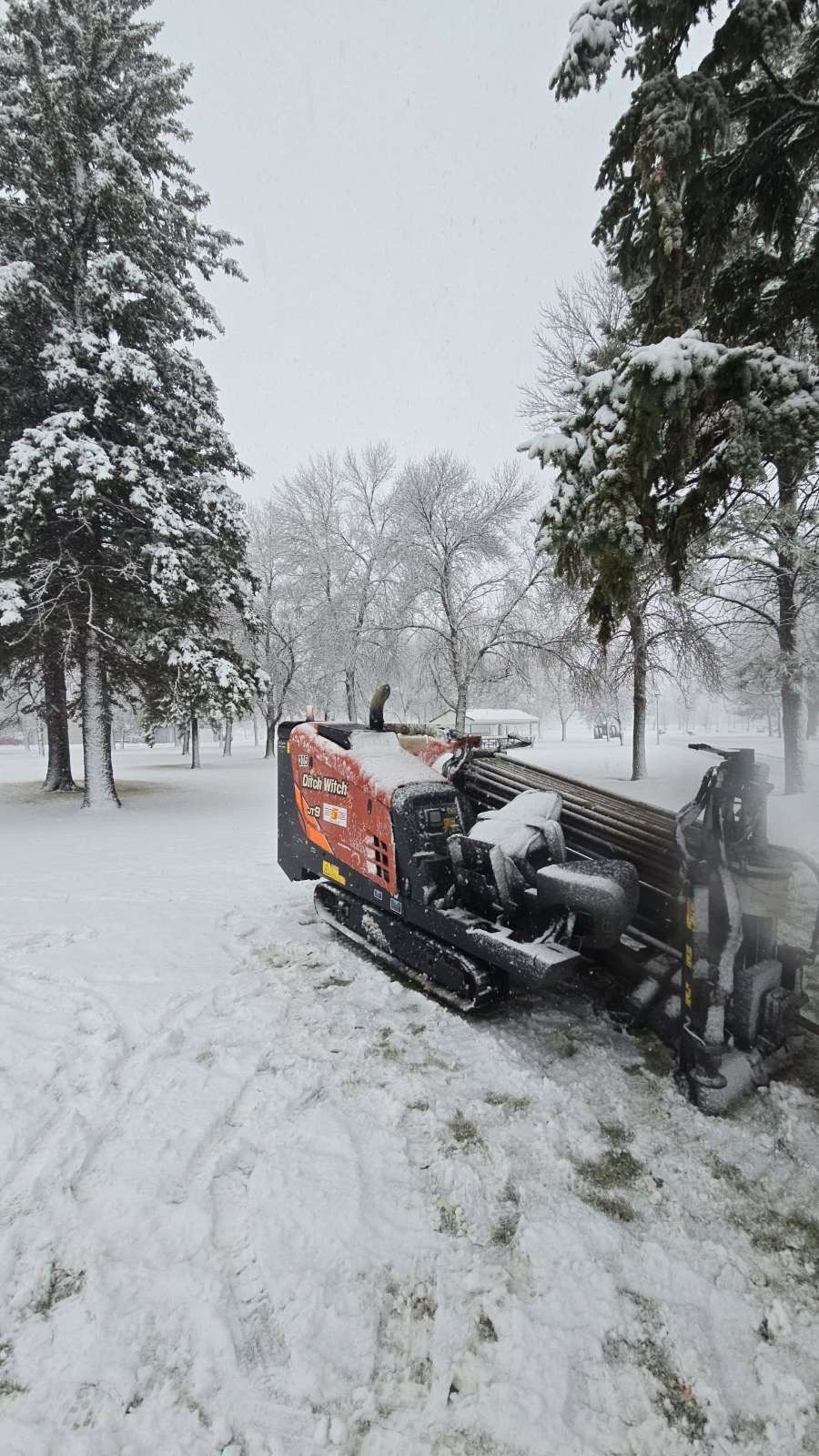 Ditch Witch directional drill installing underground utilities in winter in west-central Minnesota Ditch Witch directional drill installing underground utilities in winter in west-central Minnesota
